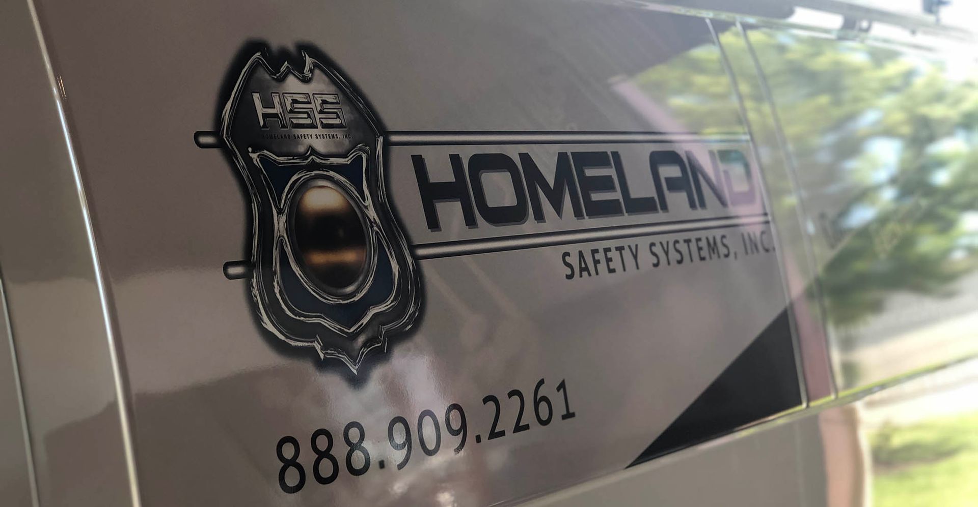 A close up of a homeland safety systems van