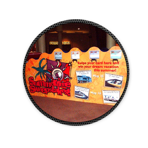 A sign that says swipe your card here and win your dream vacation this summer