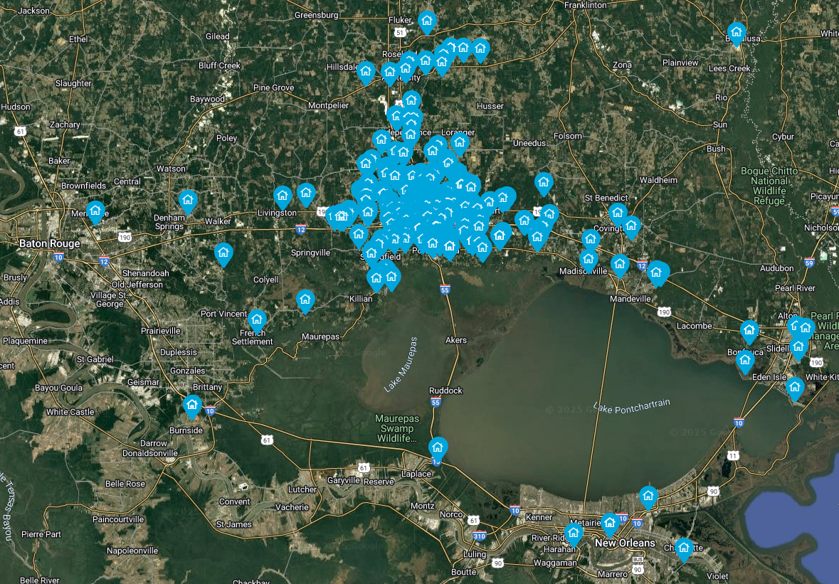 An aerial view of a city with blue dots on it