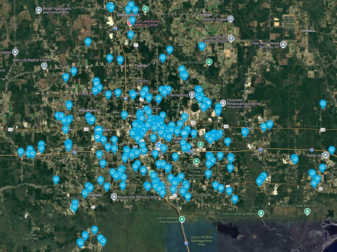 An aerial view of a city with blue dots on it