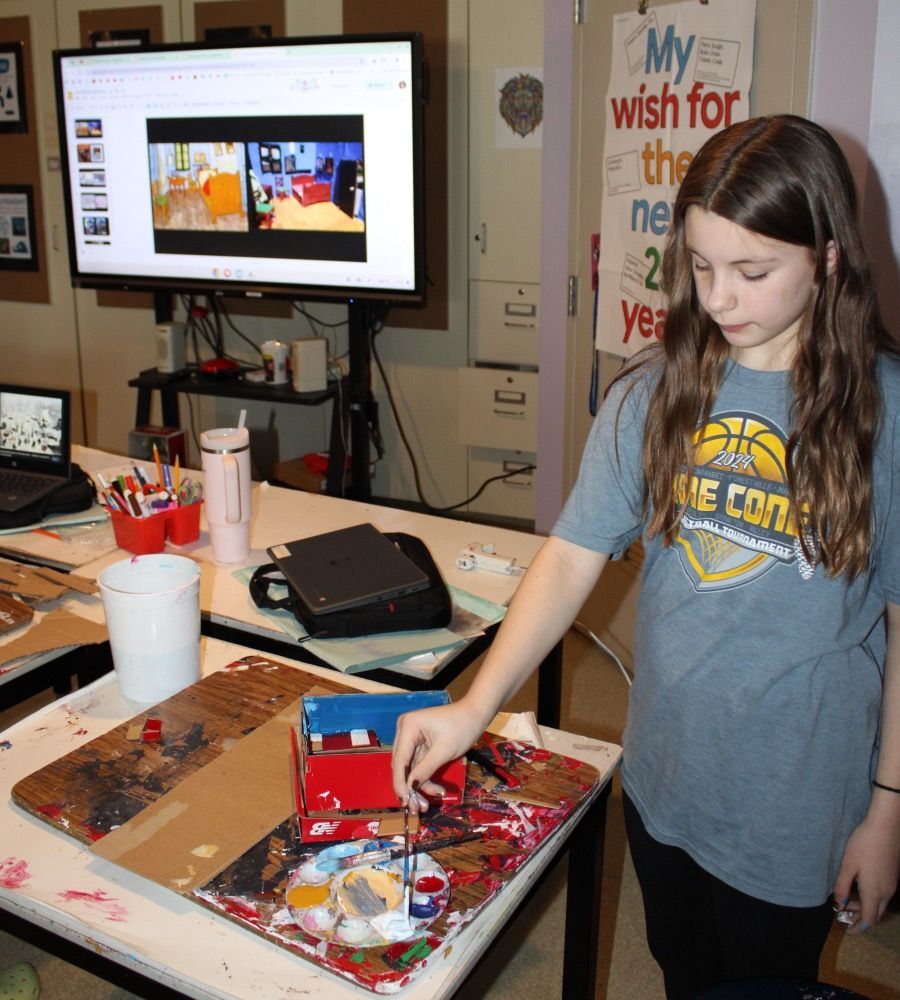 A girl wearing a shirt that says