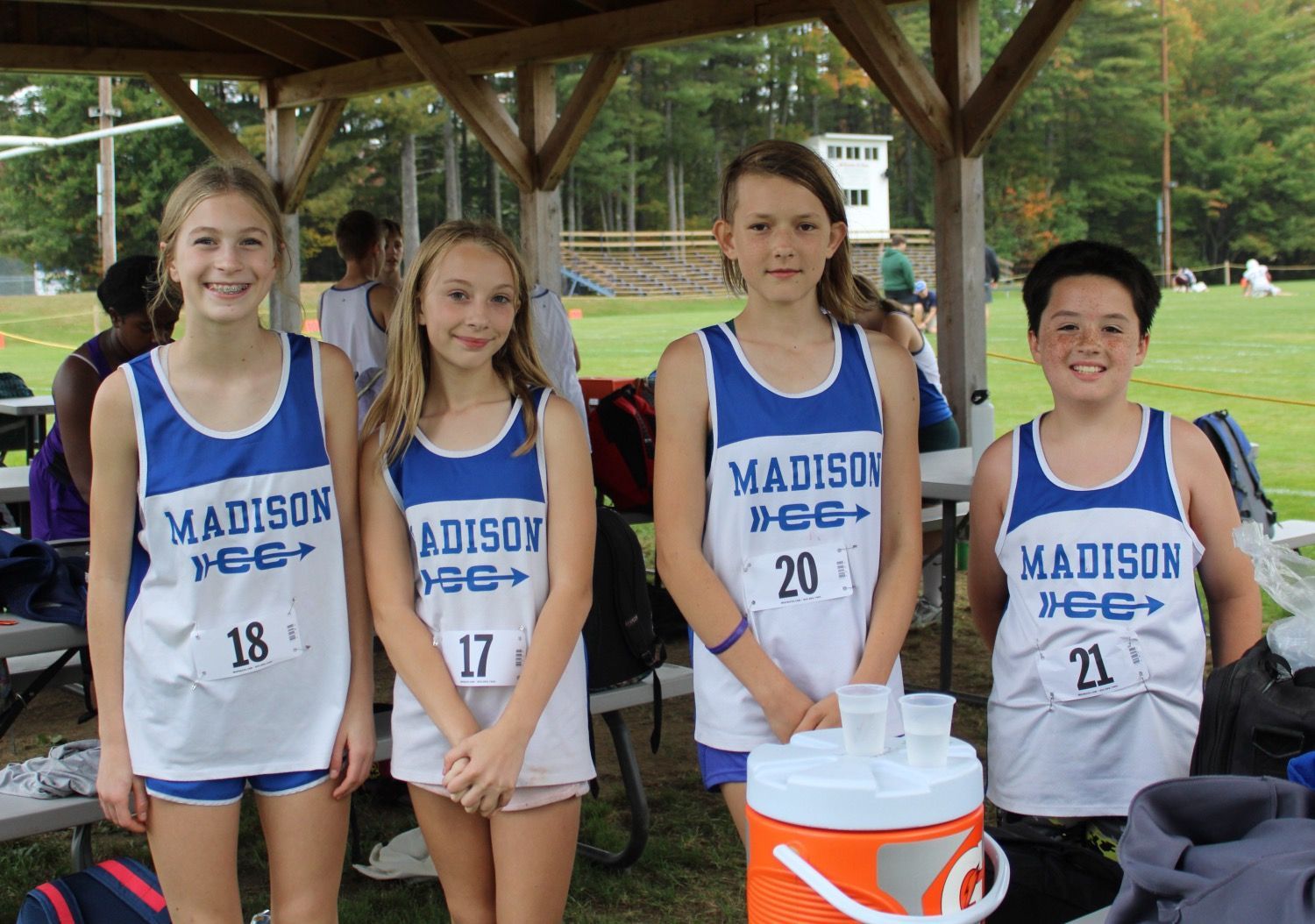 cross country runners posing for photo