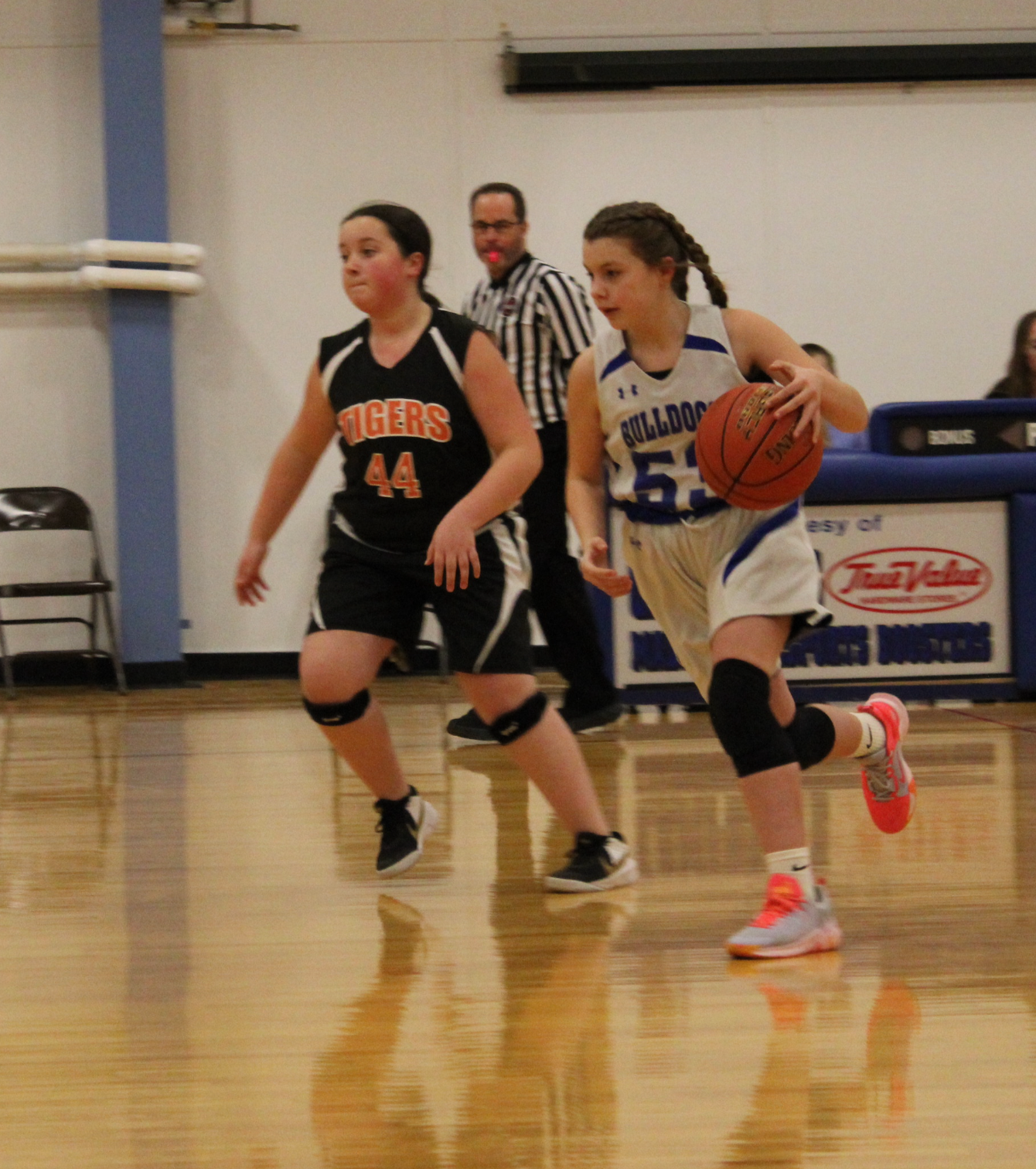 A female basketball player with the number 44 on her jersey