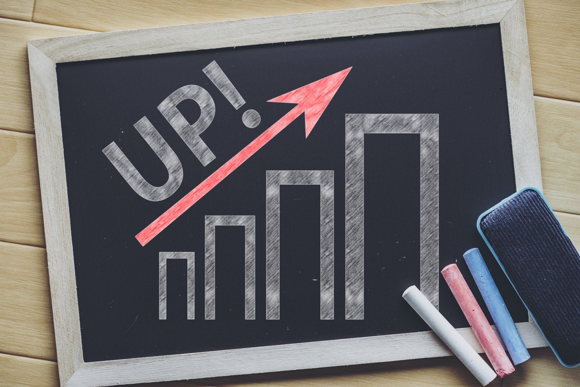 A chalkboard with the word up written on it