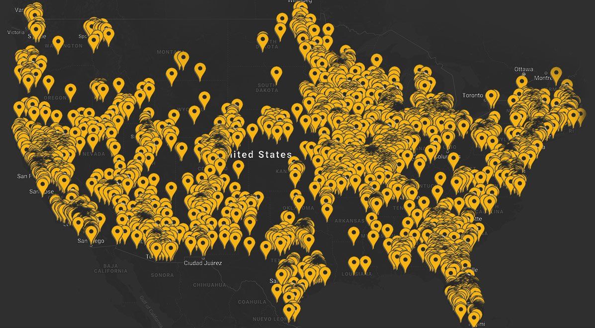 A map of the united states with yellow pins on it