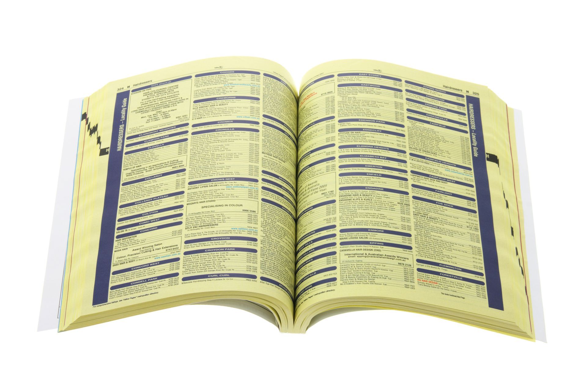 A yellow book is open to a page that says ' telephone directory ' on it