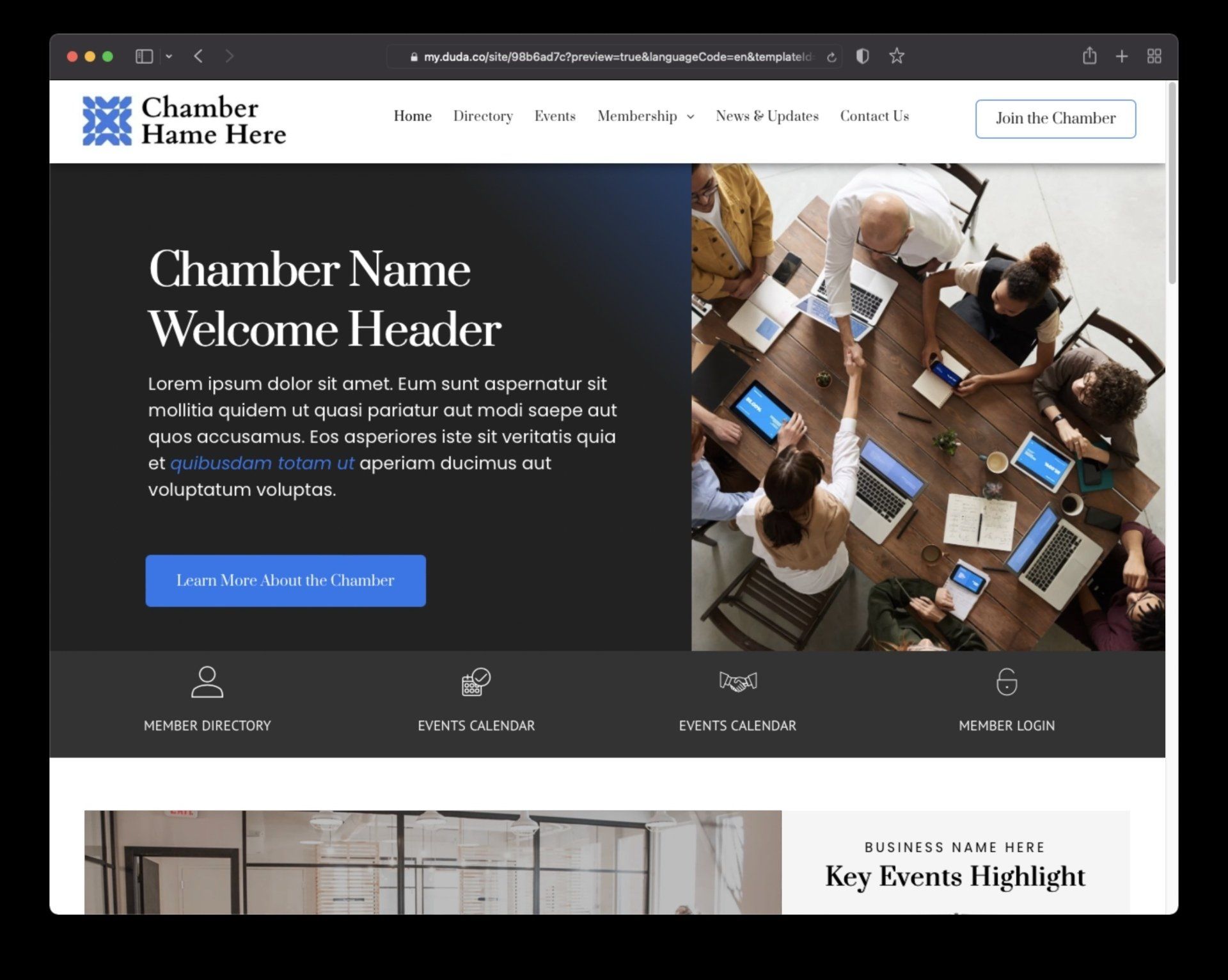 A group of people are sitting around a table with laptops.