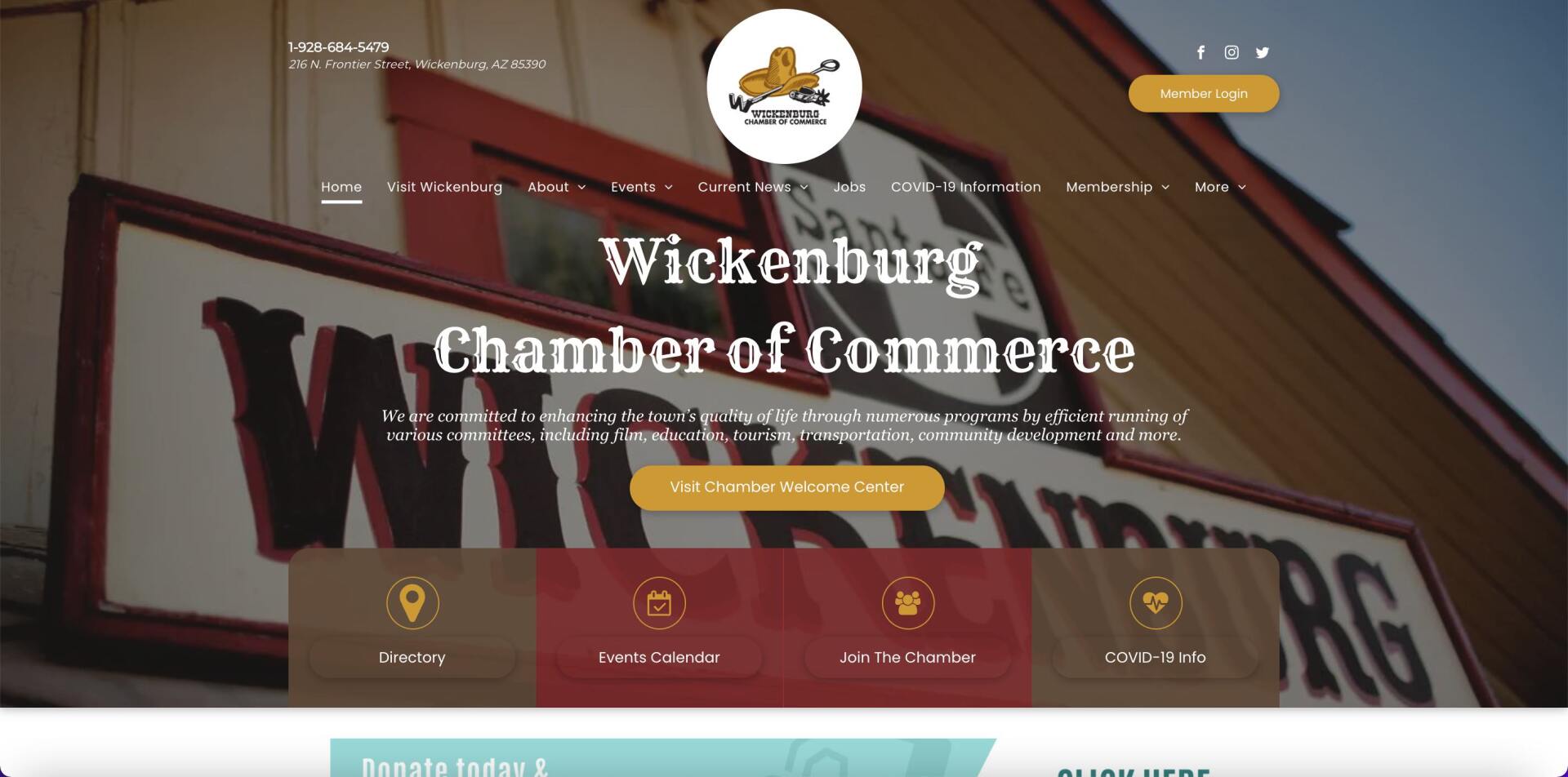 A wickenburg chamber of commerce website shows a picture of a building and a sign.