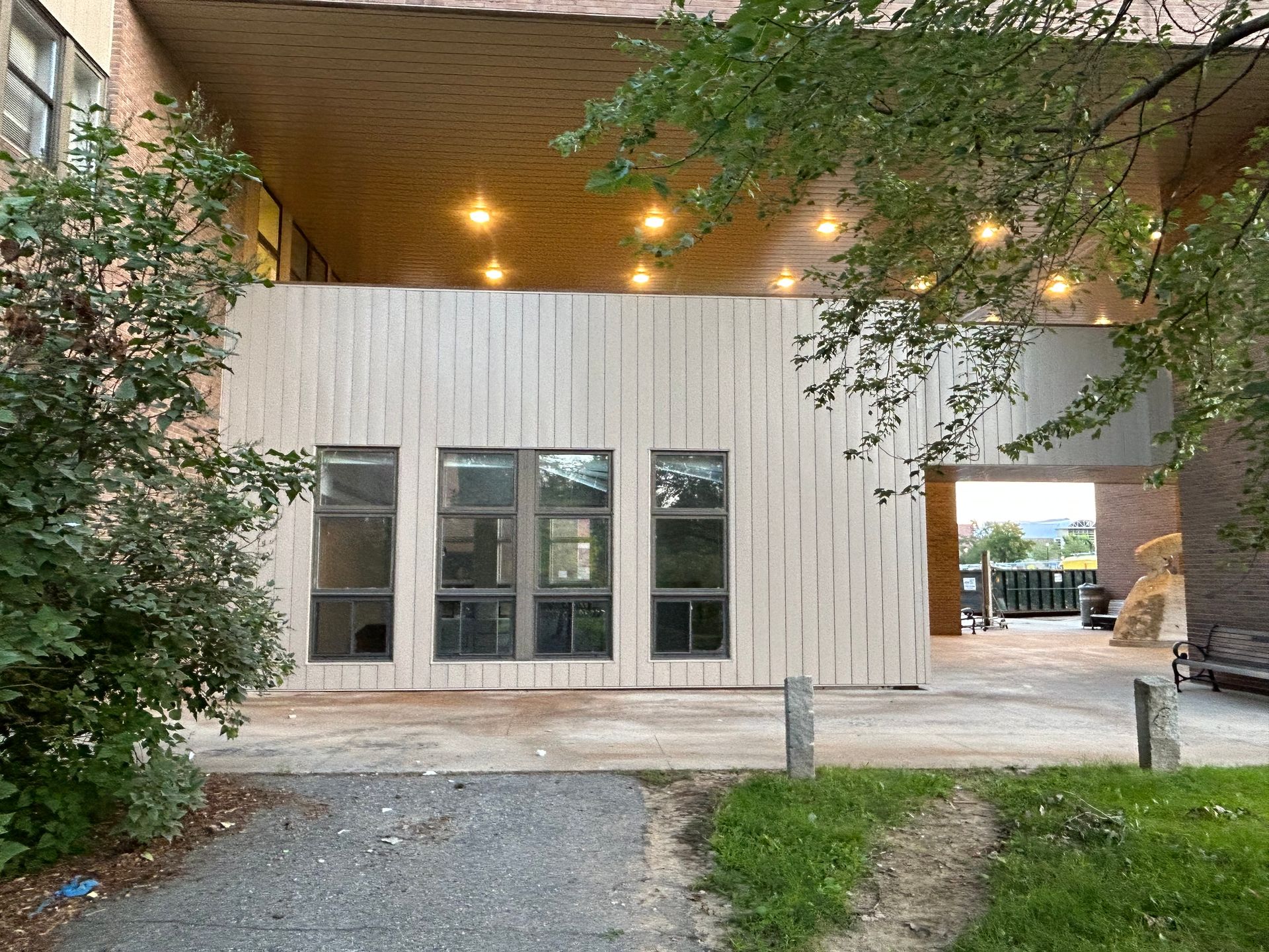 A building with a lot of windows and a path leading to it