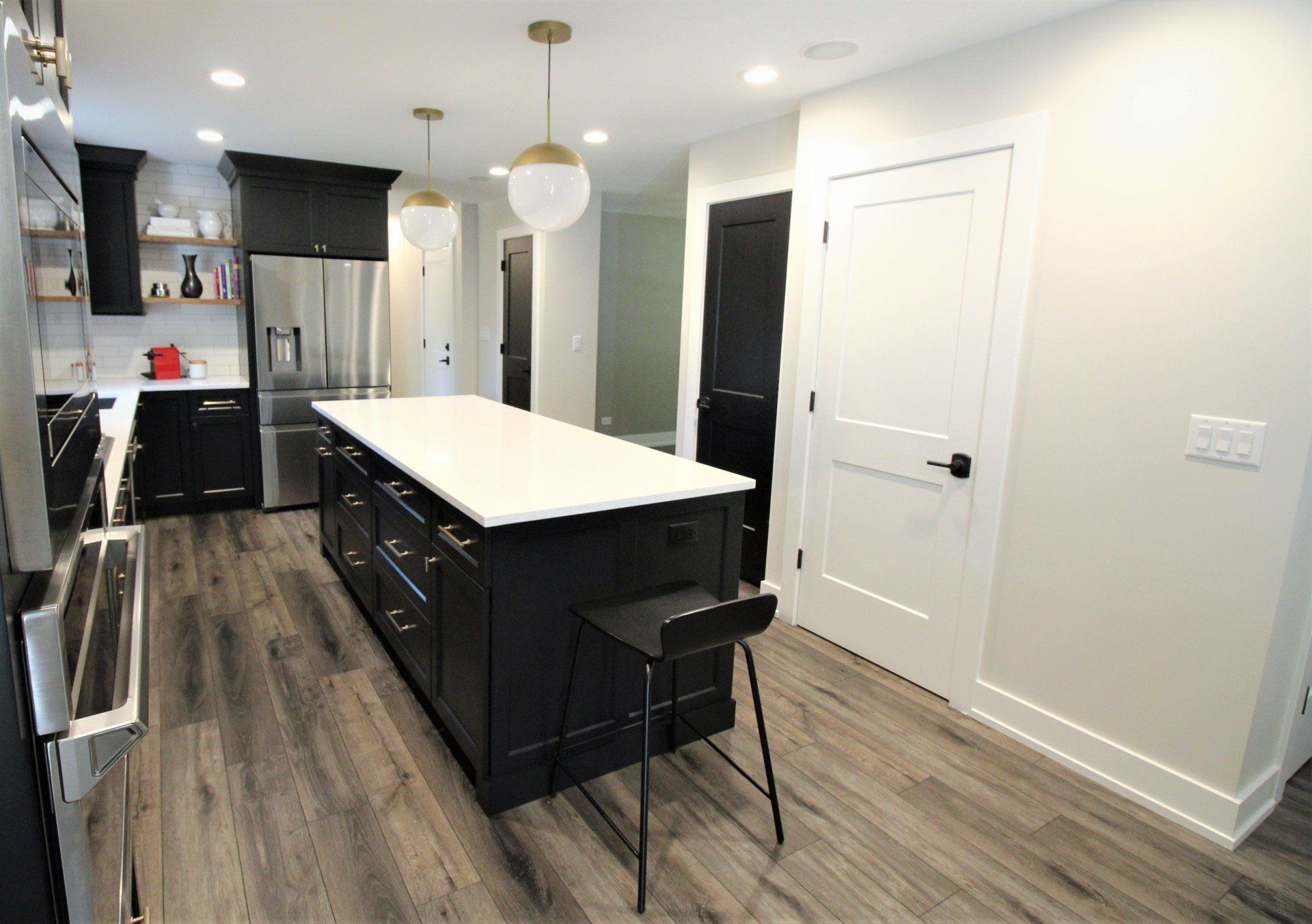 There is a large island in the middle of the kitchen.