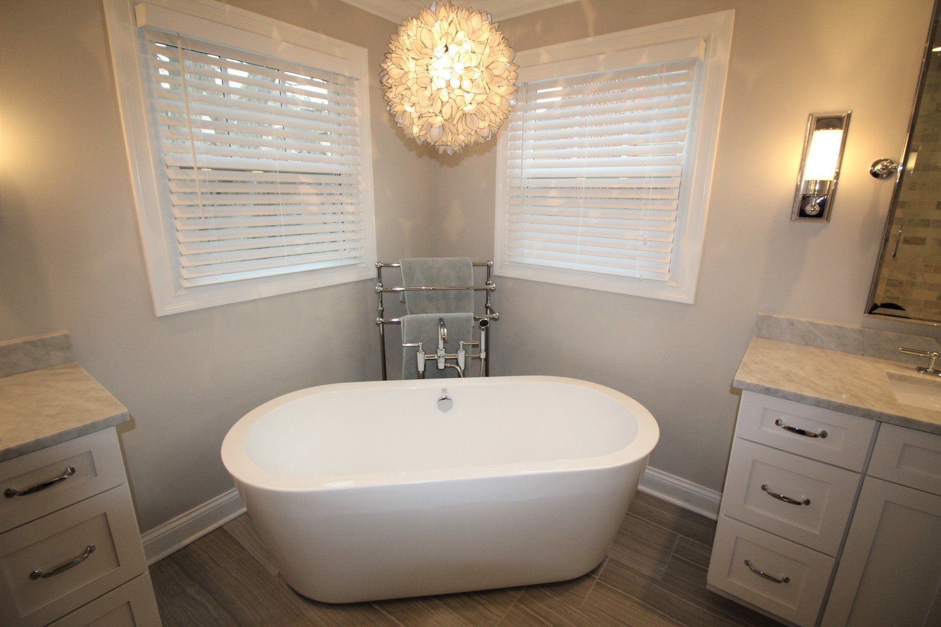 There is a bathtub in the middle of the bathroom.