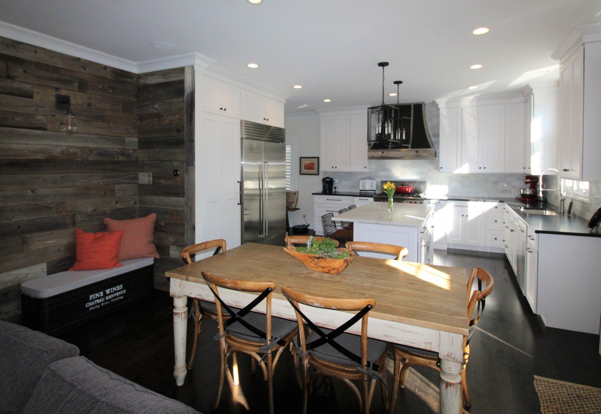 A kitchen with a table and chairs in it