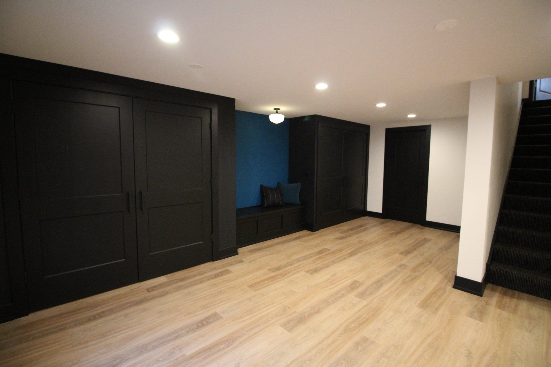 There is a bench in the middle of the room in the basement.