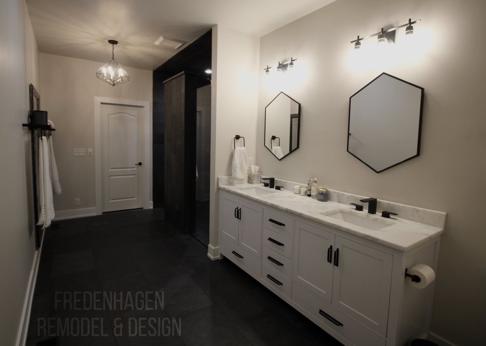 A bathroom with two sinks and two mirrors.