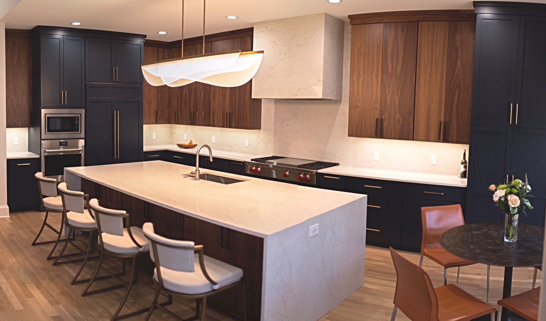 There is a large island in the middle of the kitchen.