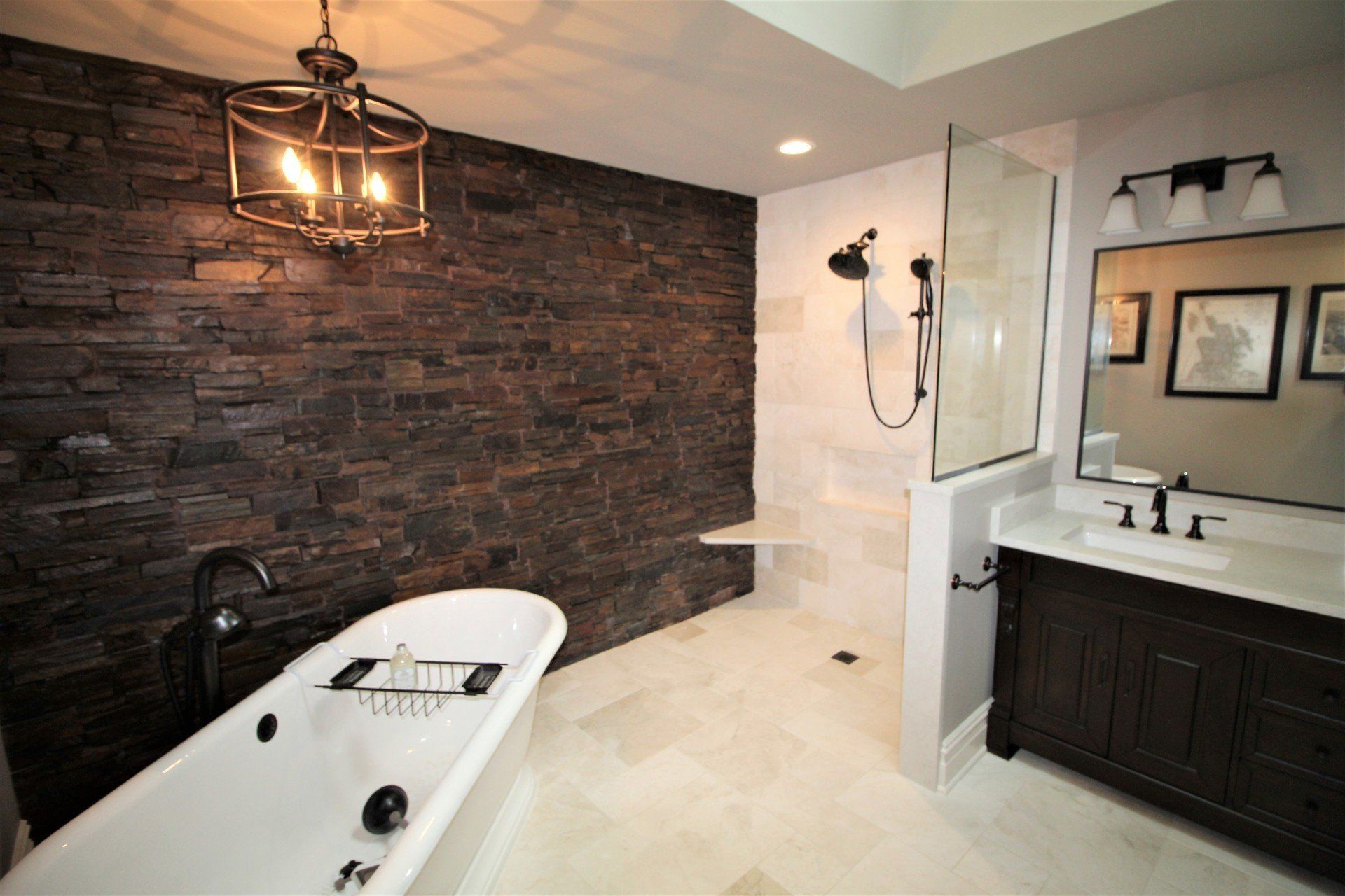 A bathroom with a bathtub , sink , and shower.