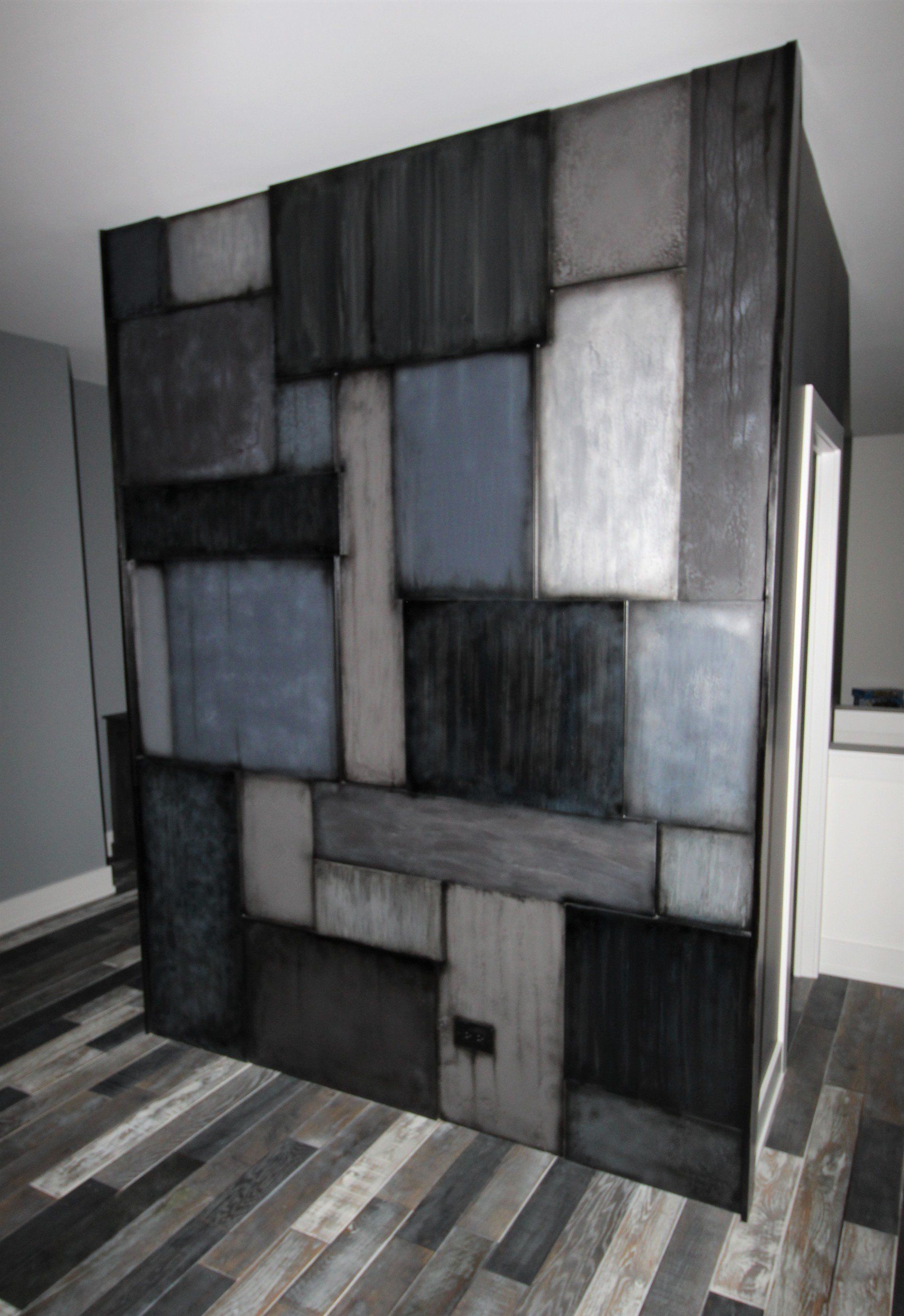 A room with a brick wall and a wooden floor