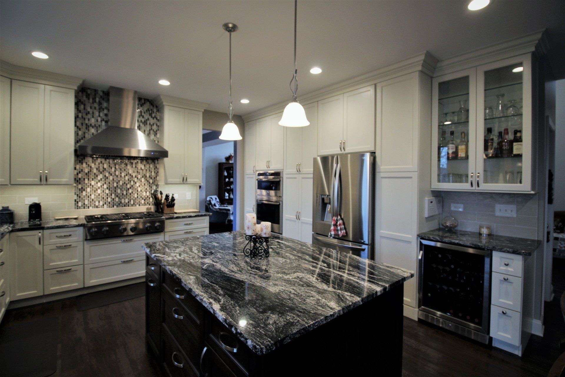 A kitchen with stainless steel appliances and granite counter tops