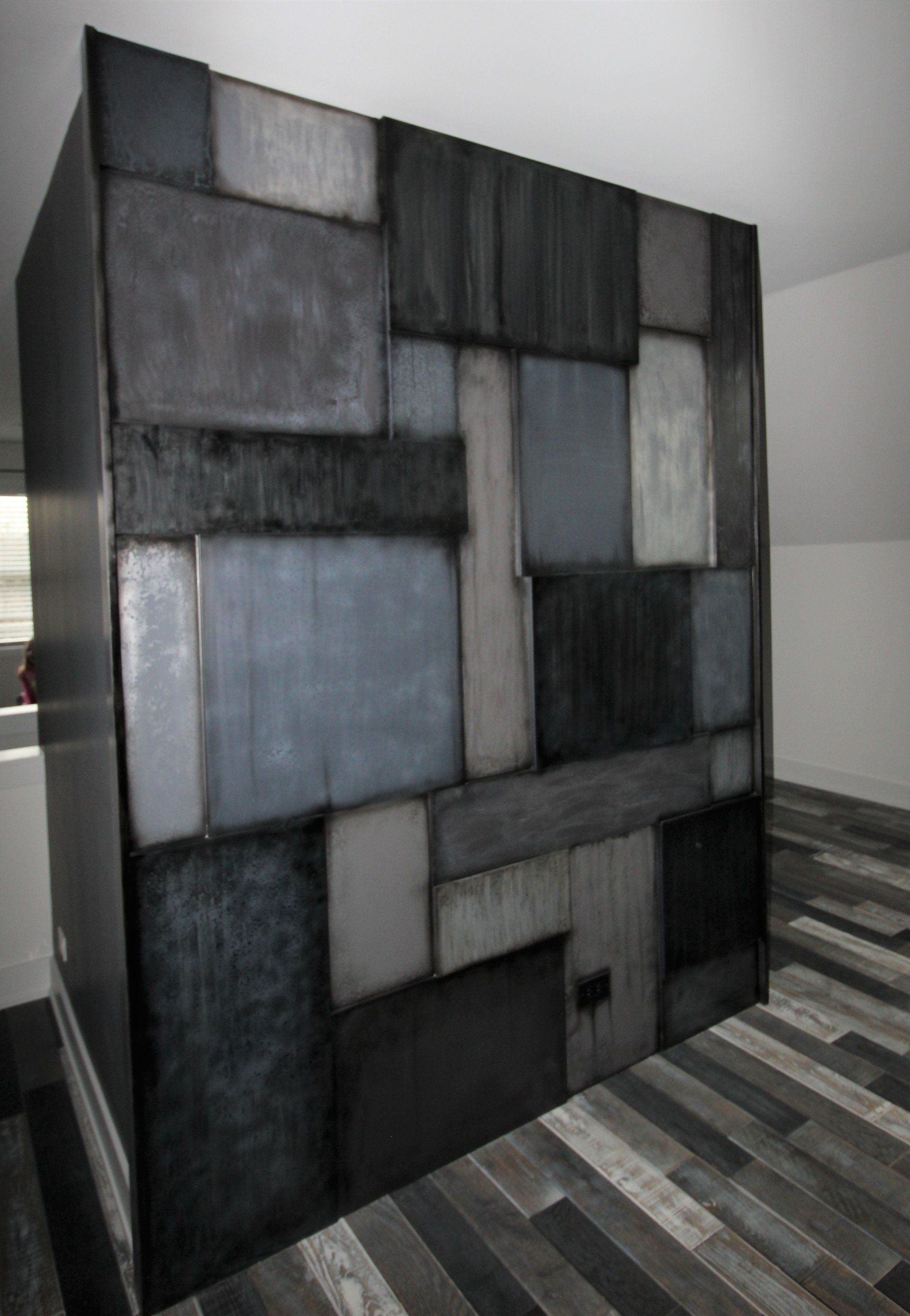 A room with a brick wall and a wooden floor