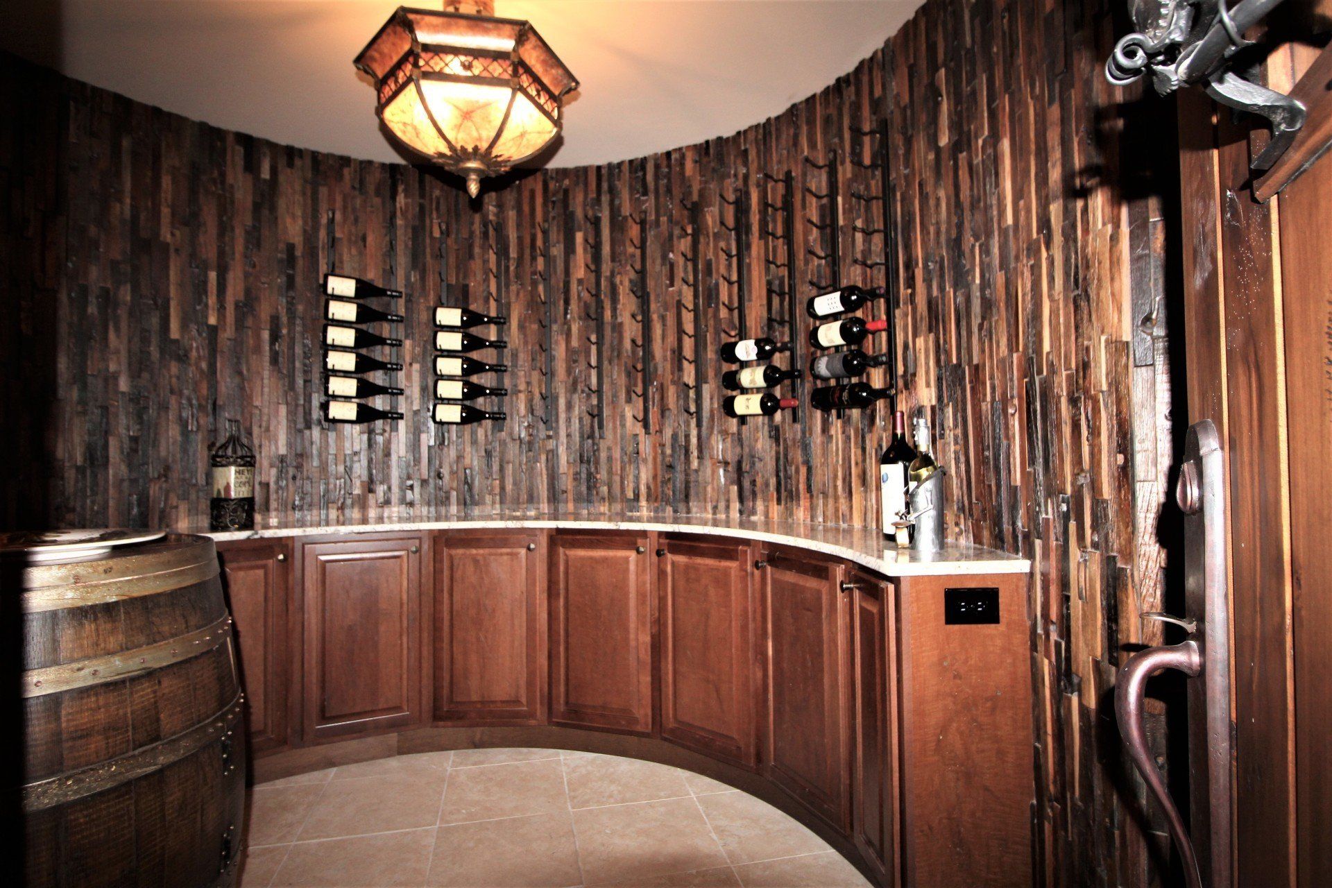 A wine cellar with wooden cabinets and barrels.
