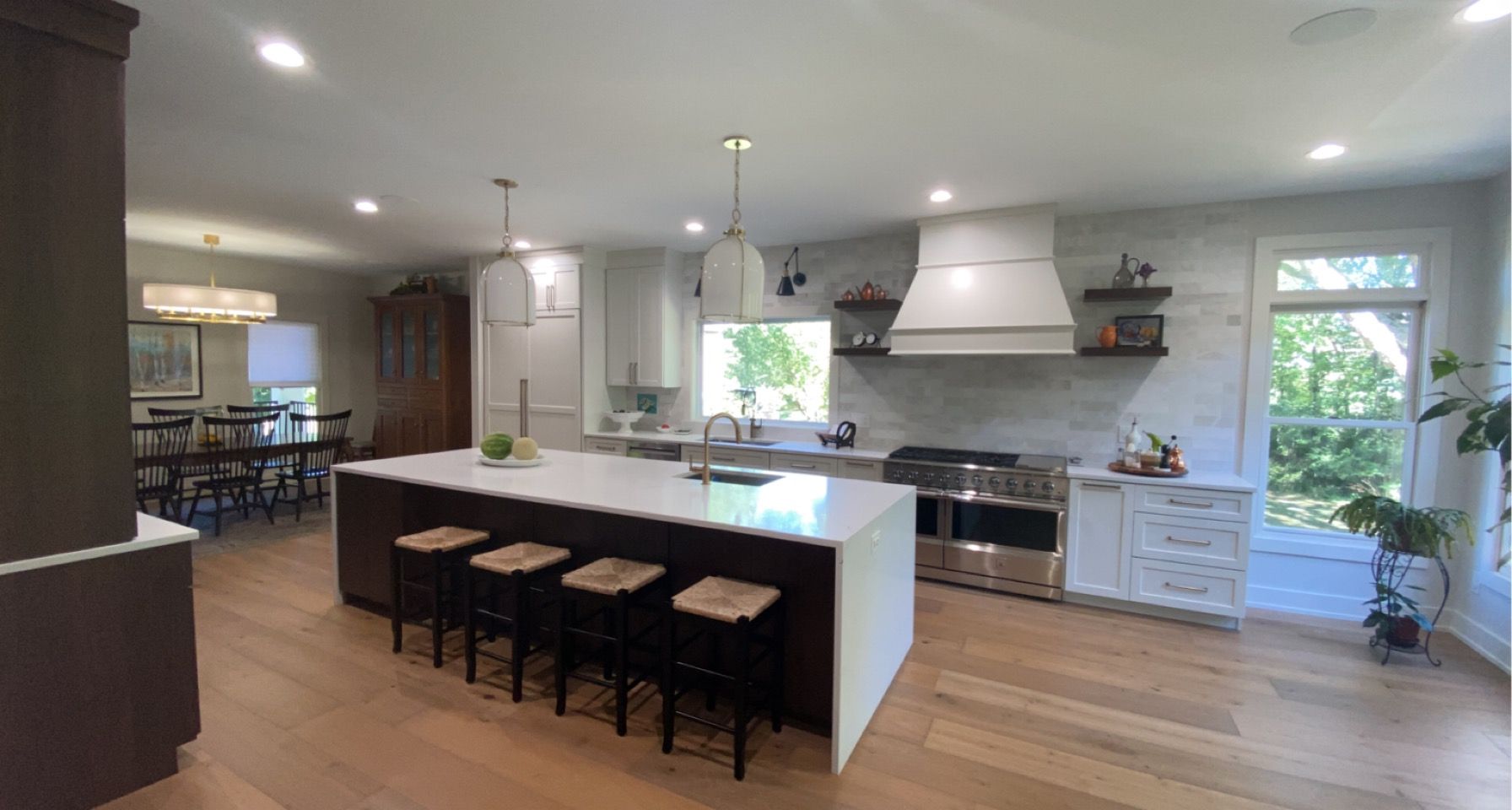 A large kitchen with a large island and stools.