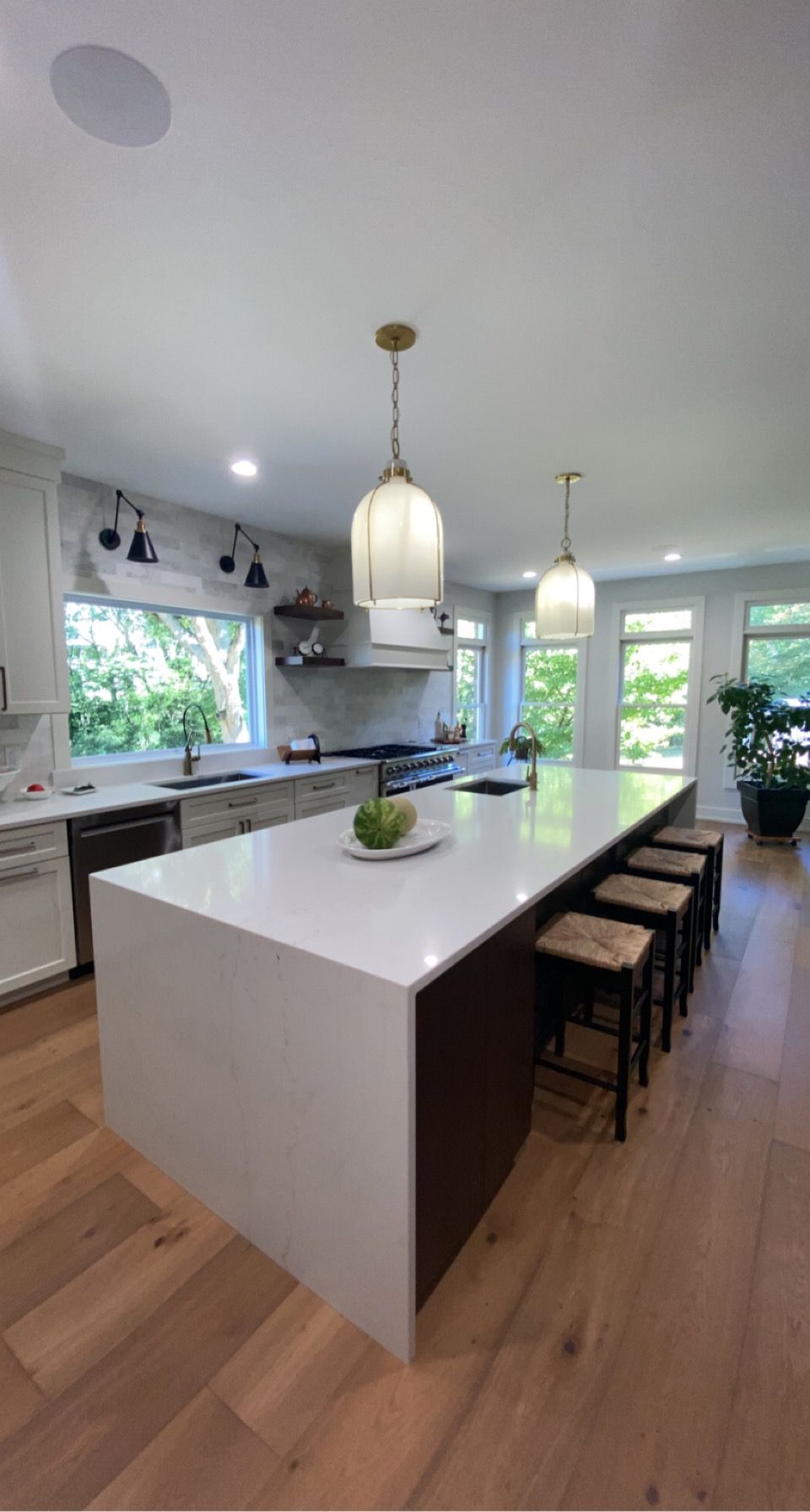 There is a large island in the middle of the kitchen.