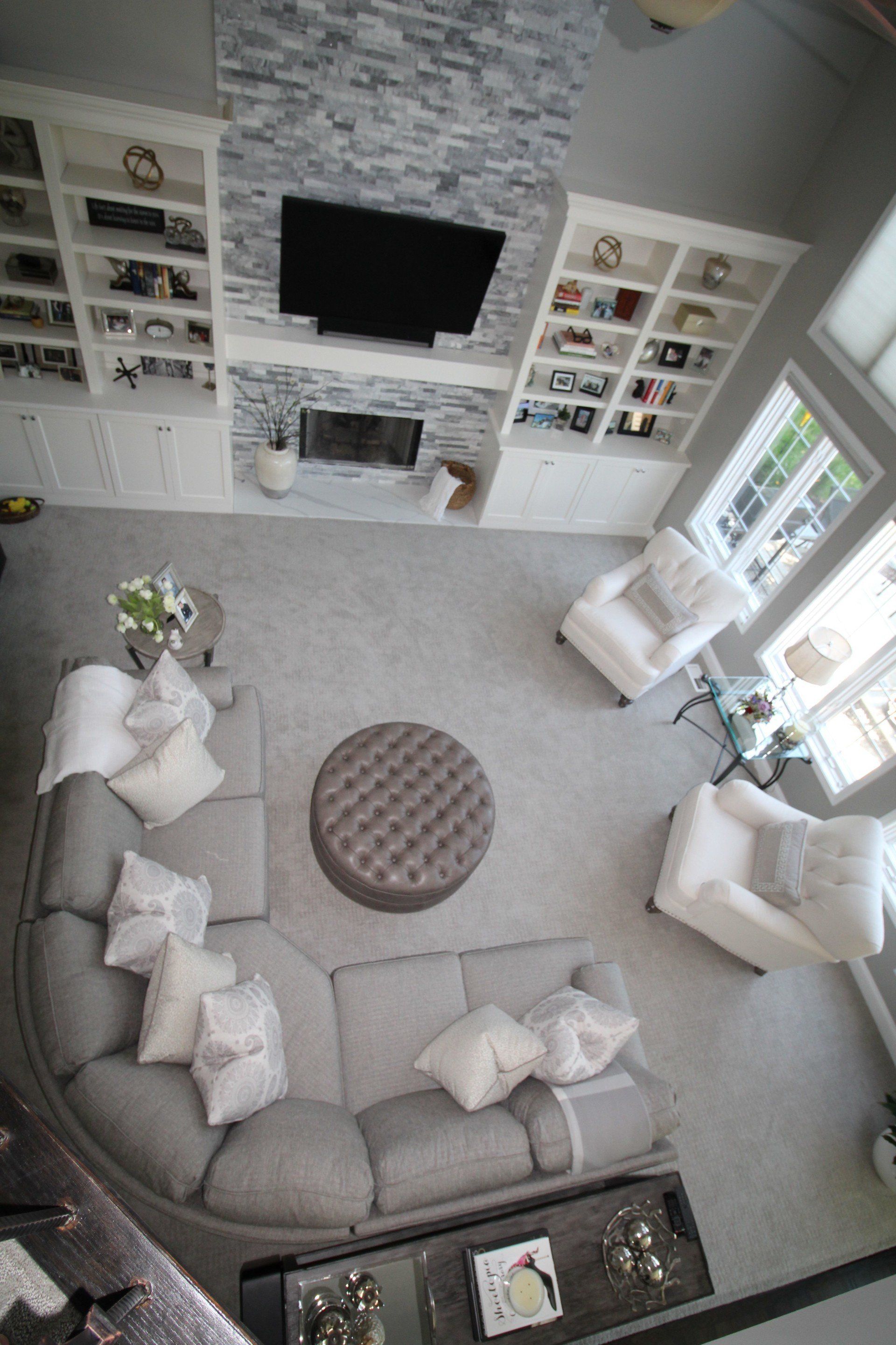 An aerial view of a living room filled with furniture and a fireplace.