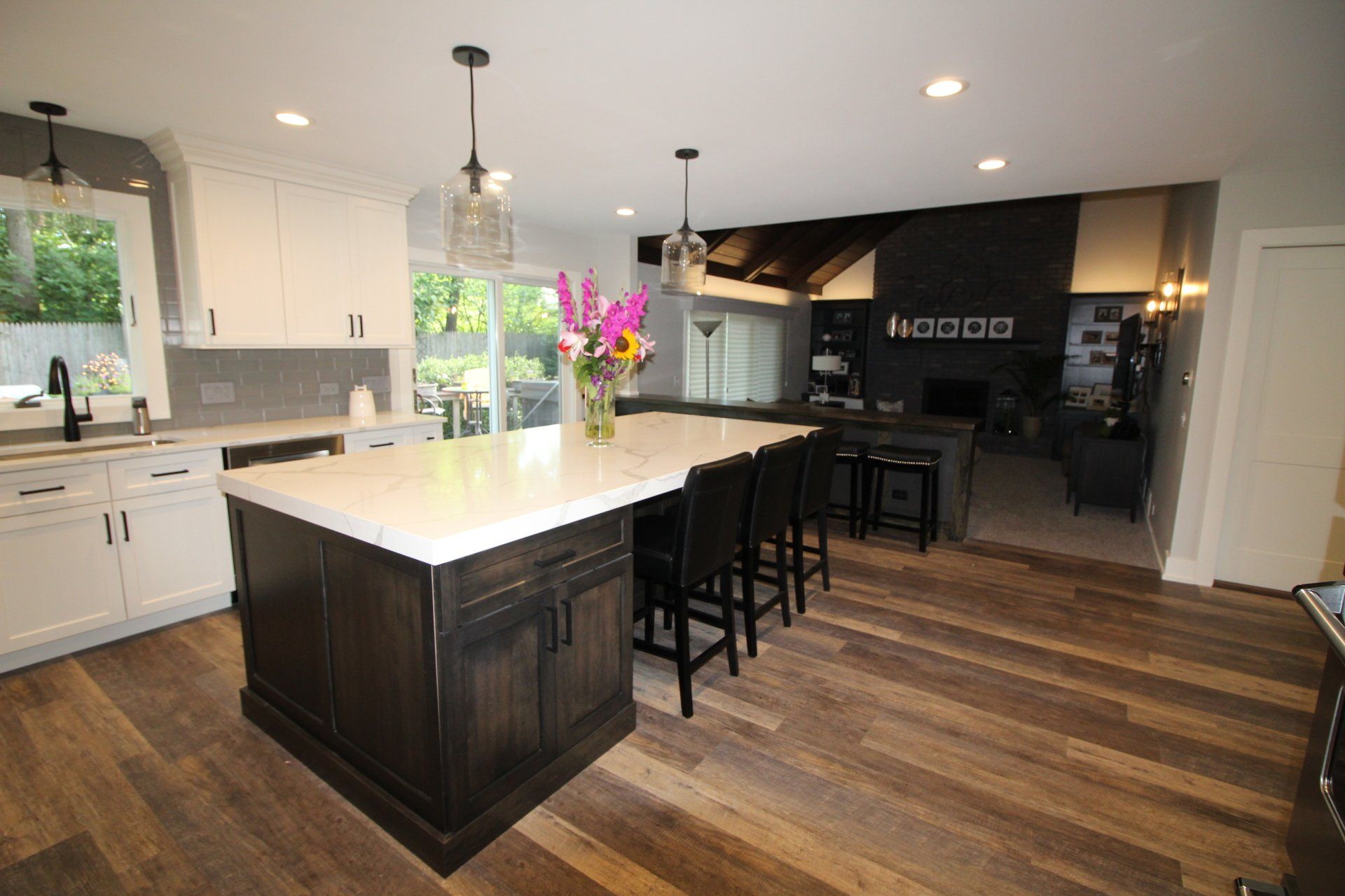 There is a large island in the middle of the kitchen.