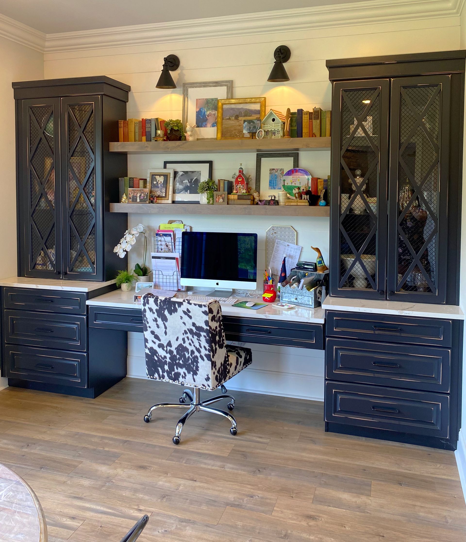 A desk with a computer and a chair in a room