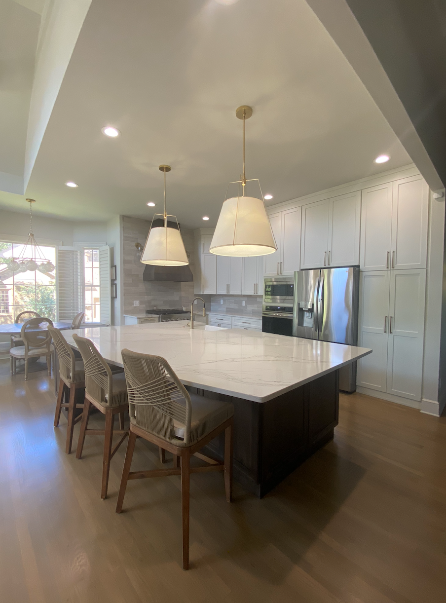 There is a large island in the middle of the kitchen.