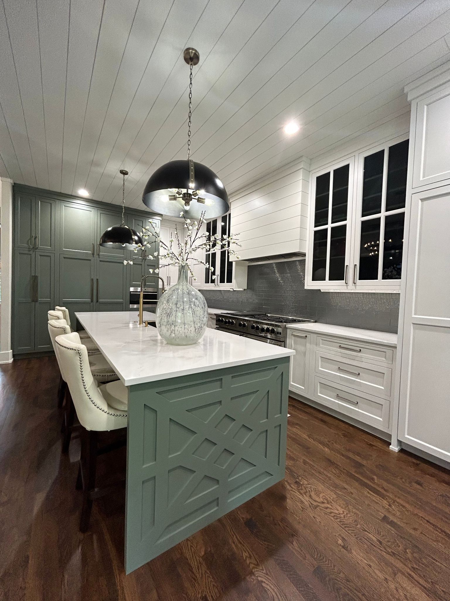 A kitchen with a large island in the middle of it