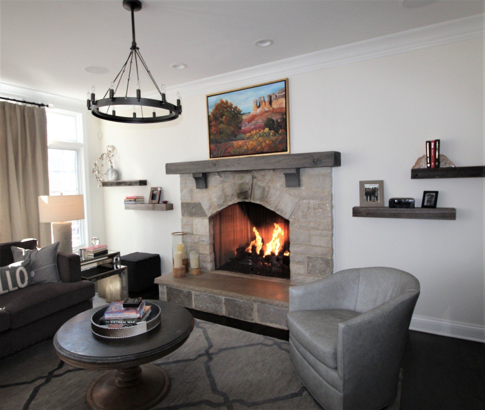 A living room with a fireplace and a couch that says hello