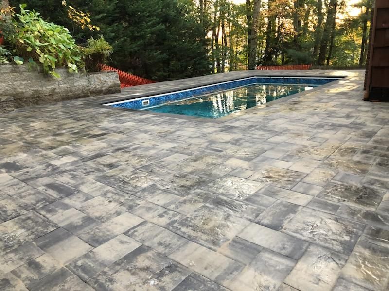 A house with a large patio in front of it