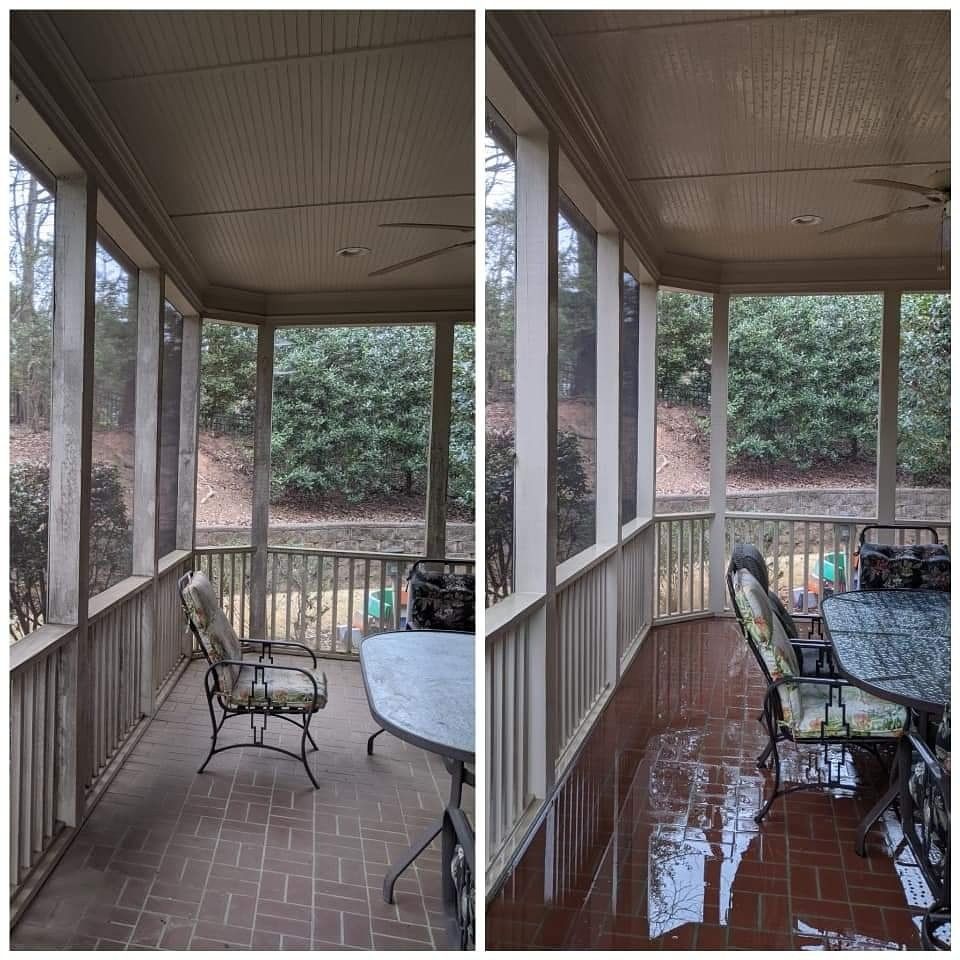 A screened in porch with a table and chairs