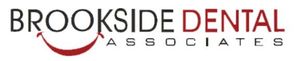 A logo for brookside dental associates with a red smile