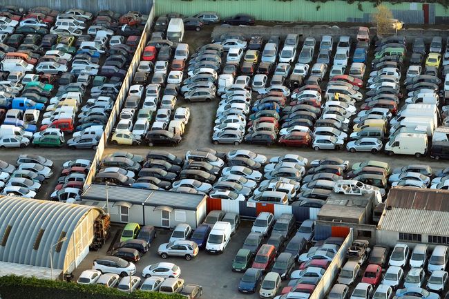 An aerial view of a parking lot filled with lots of cars