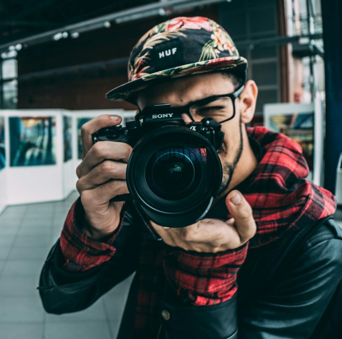 A man taking a picture with a sony camera