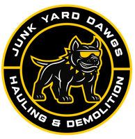 A logo for junk yard dawgs hauling and demolition llc