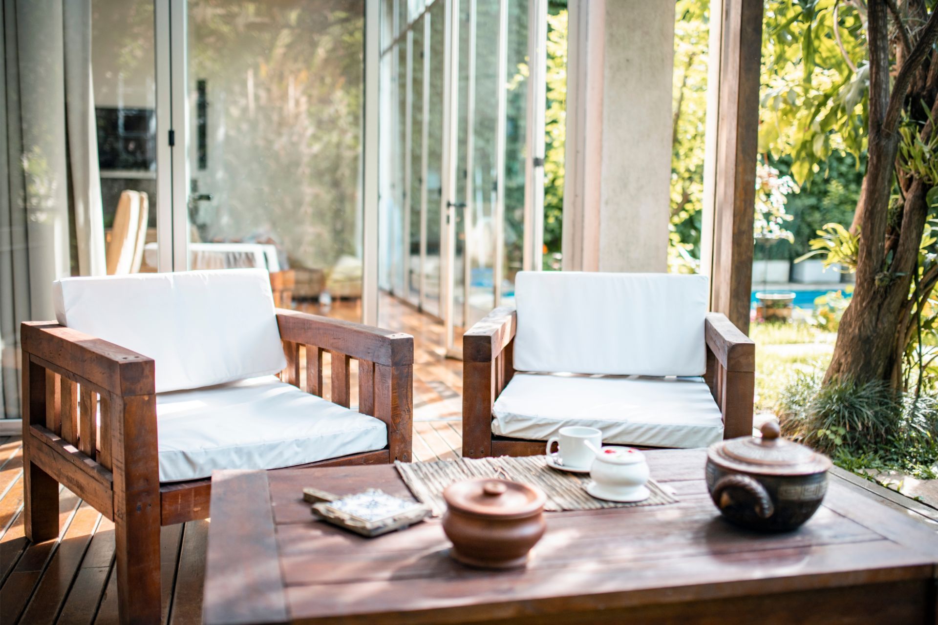 Zen deck area with wooden furniture and tea set in Saint Paul, MN.