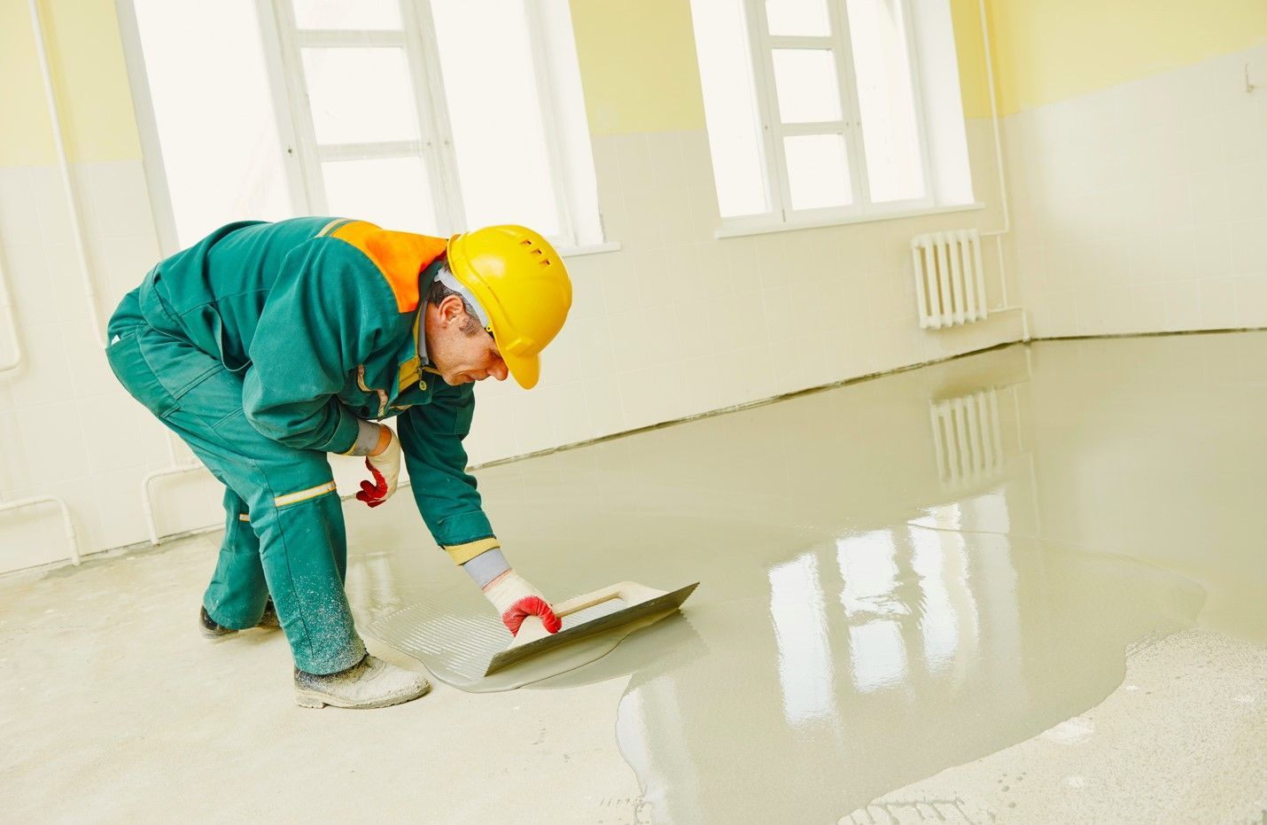 A skilled man working on concrete flooring in Holland, MI