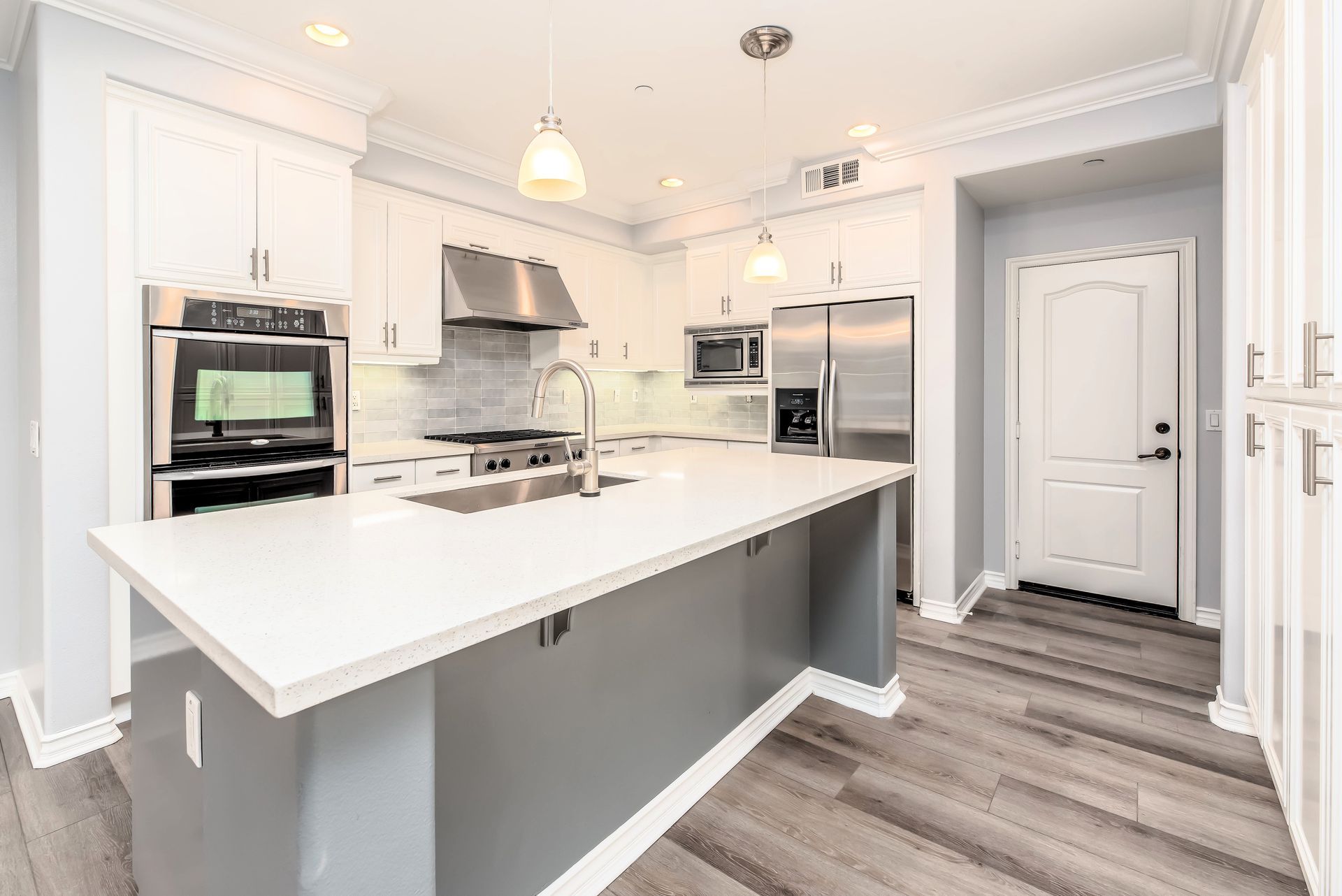 White concrete kitchen countertop with sleek and modern design.