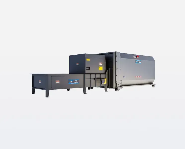 Industrial waste compactor with loading table, grey and black.