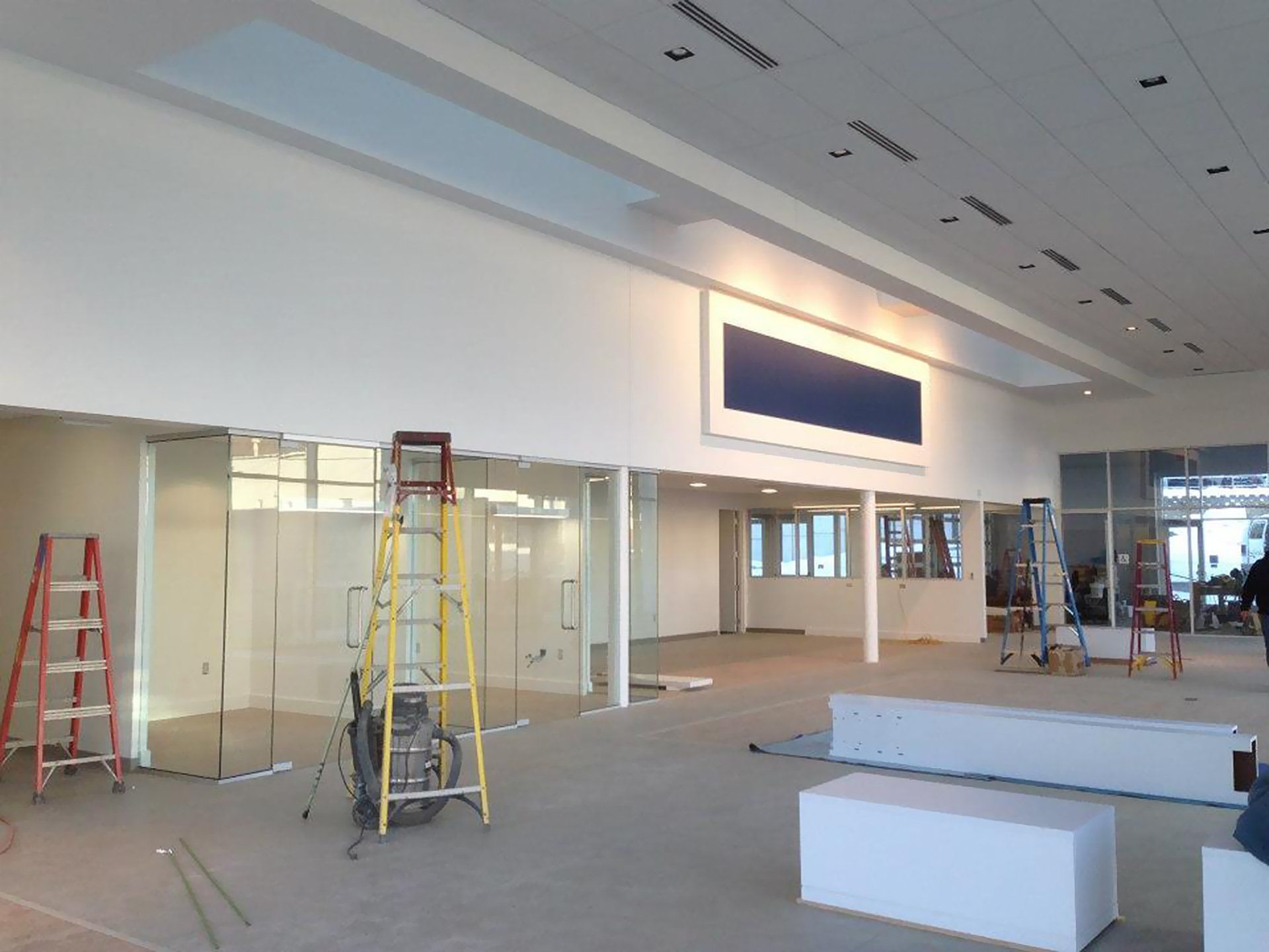 A large room with a blue sign on the wall.