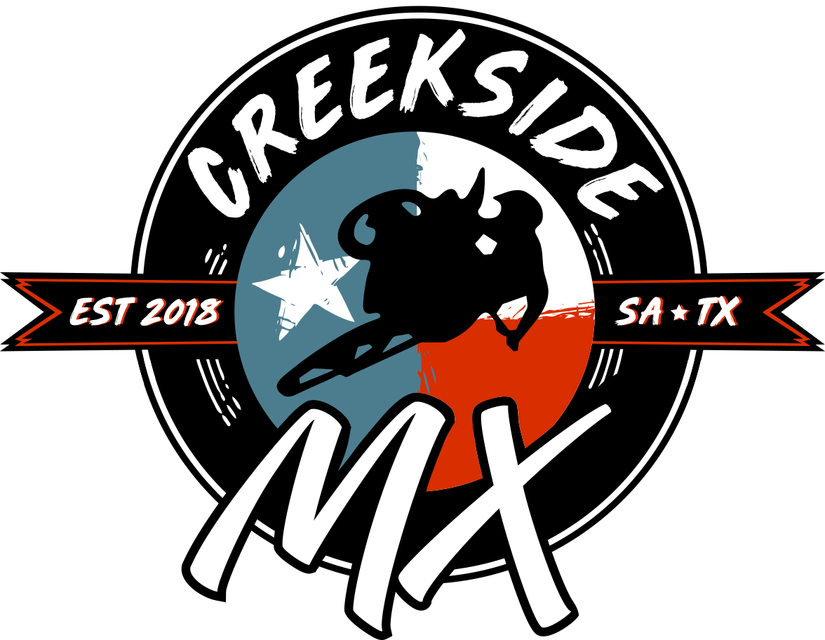 the logo for creekside mx is a circle with a sheep on it .