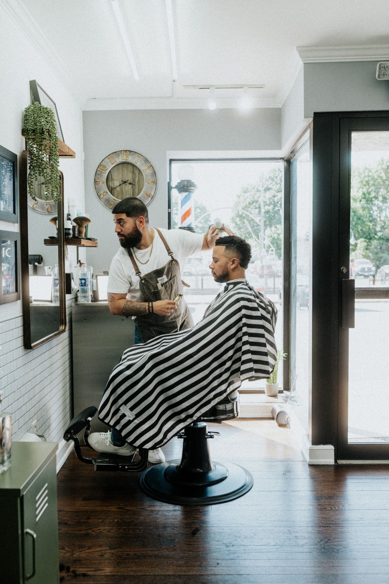 Client getting a precision haircut at Modern Man Barber Studio in Long Branch, NJ, for a clean cut.