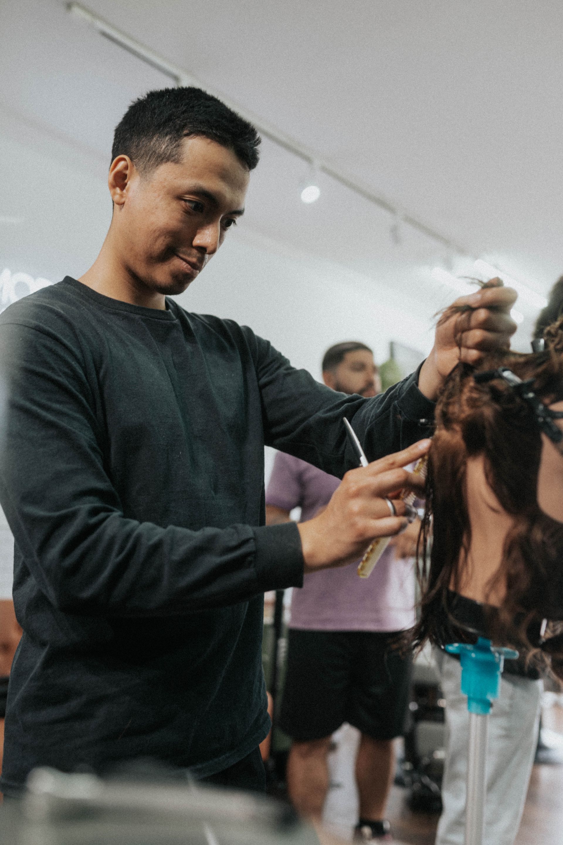 Client getting a clean fade at Modern Man Barber Studio in Long Branch, NJ, showing respectful barber shop etiquette.