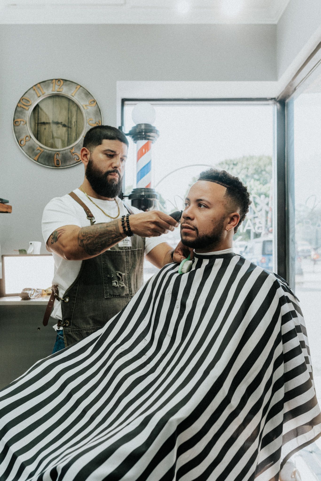 Client getting a clean skin fade and beard line up at Modern Man Barber Studio in Long Branch, NJ for a sharp finish.