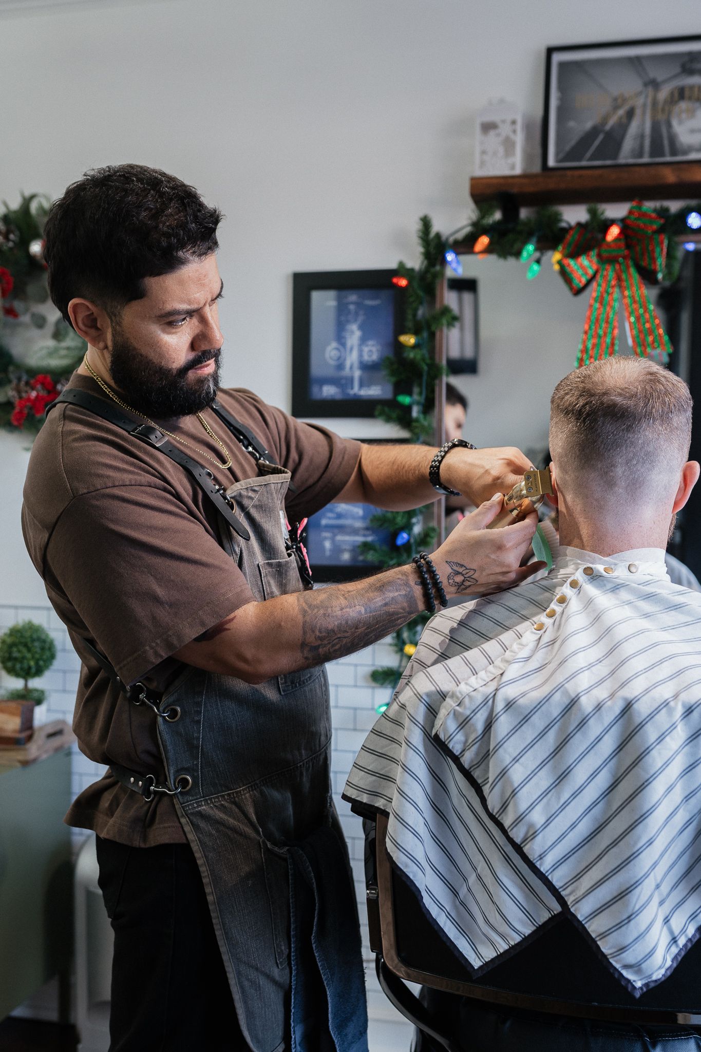 Barber finishing a textured fade at Modern Man Barber Studio in Long Branch, NJ.