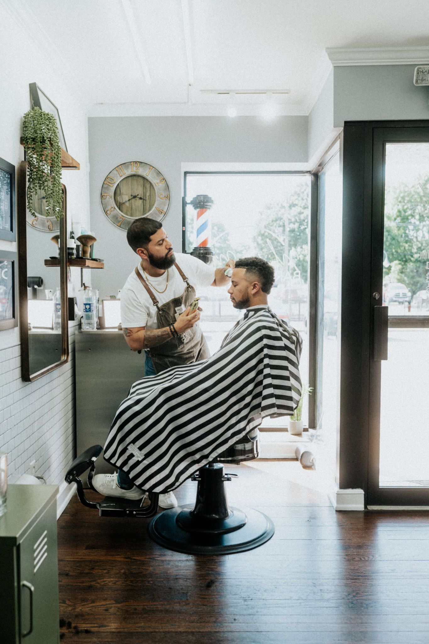 Barber shaping a clean fade and beard line at Modern Man Barber Studio in Long Branch, NJ.