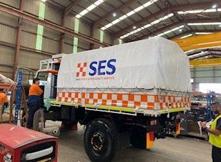 White truck with orange design | Heatherbrae, NSW | All Tarps